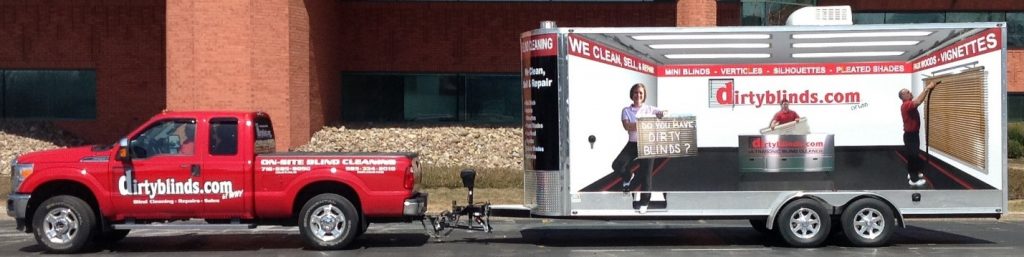 Red DirtyBlinds.com truck towing a 3D-wrapped mobile blind cleaning trailer