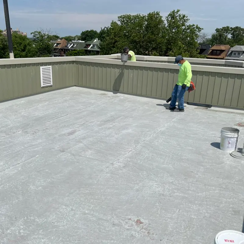 Professional contractor completing fiberglass roofing installation on residential property