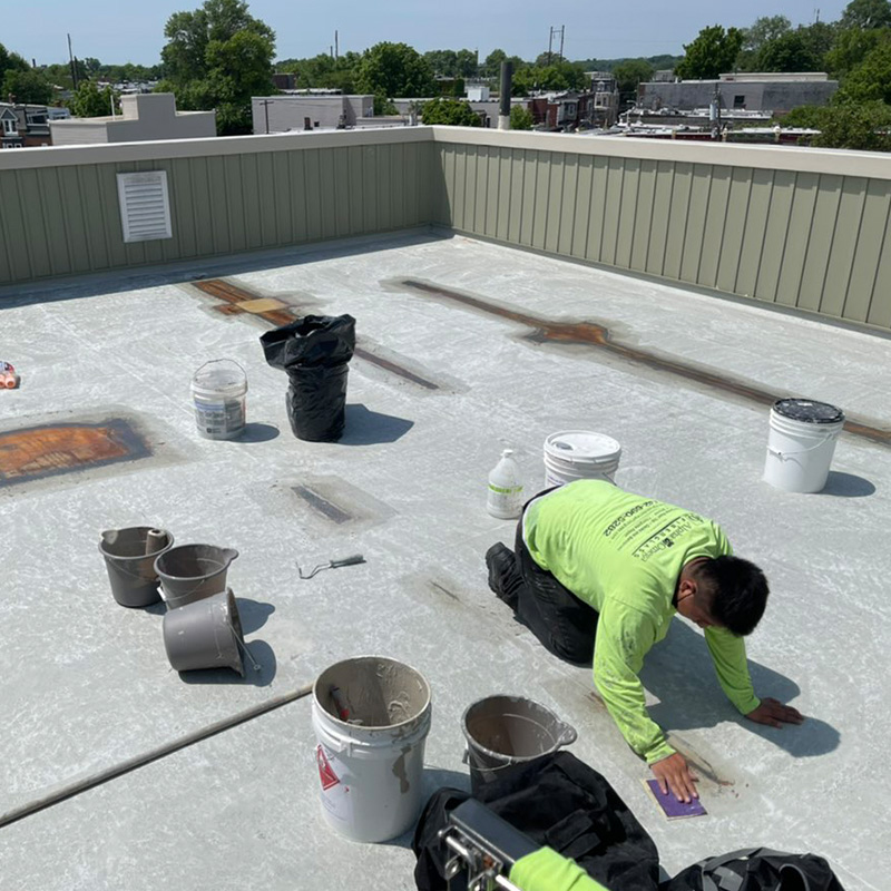 Fiberglass Roof Repair technician fixing roof for lasting protection.