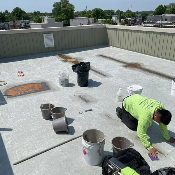 Expert technician performing fiberglass roof repair in Philadelphia, PA.