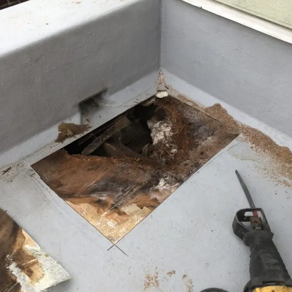 Fiberglass Roof Repair in Phoenixville, PA 1. Technician performing fiberglass roof repair in Phoenixville, PA with safety equipment