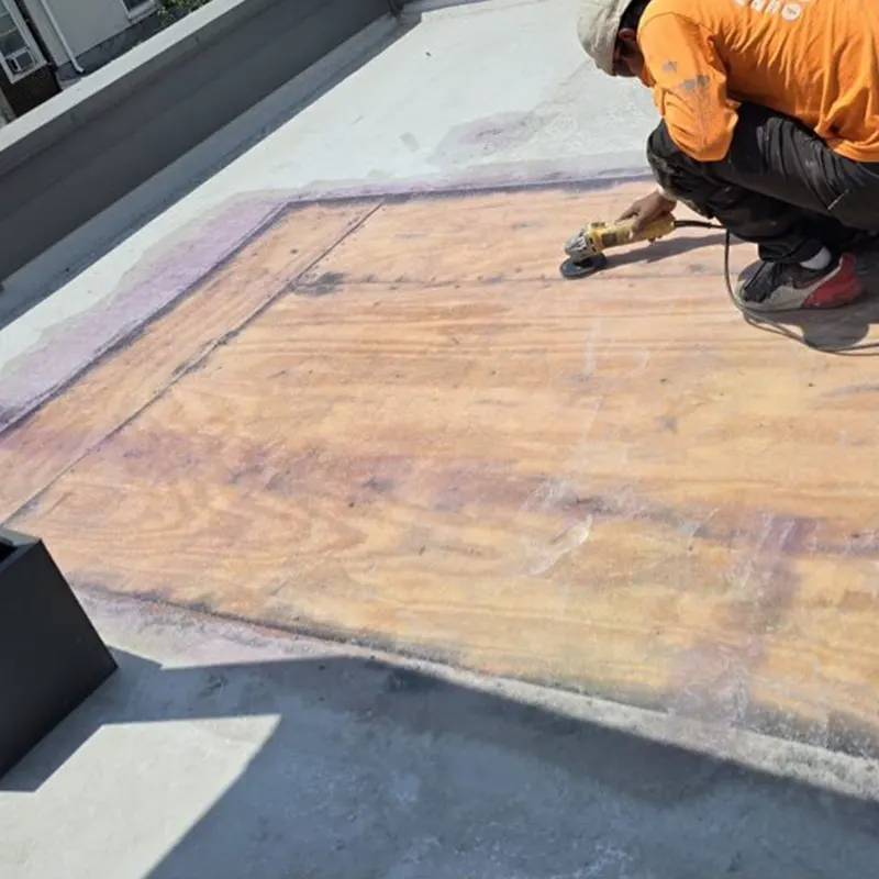 Technician performing fiberglass roof repair inspection in Upper Darby