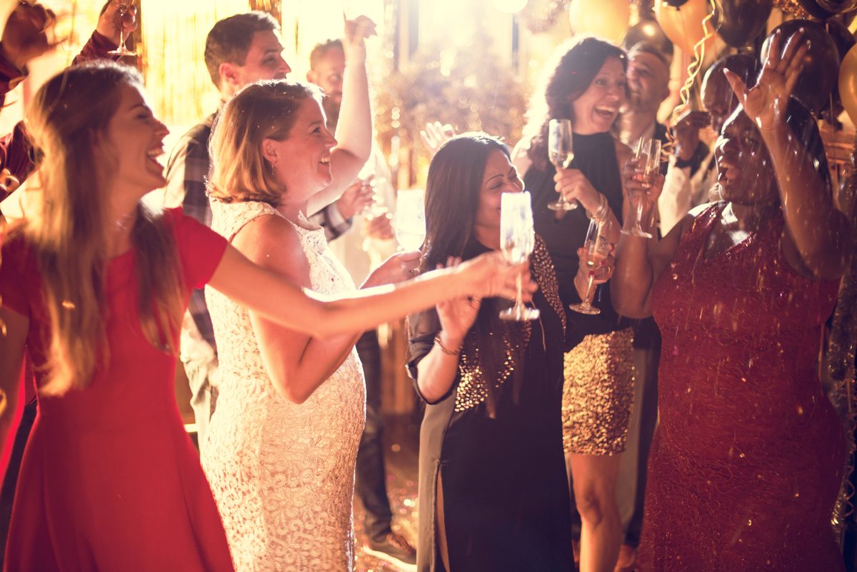 Friends dancing together at a lively celebration