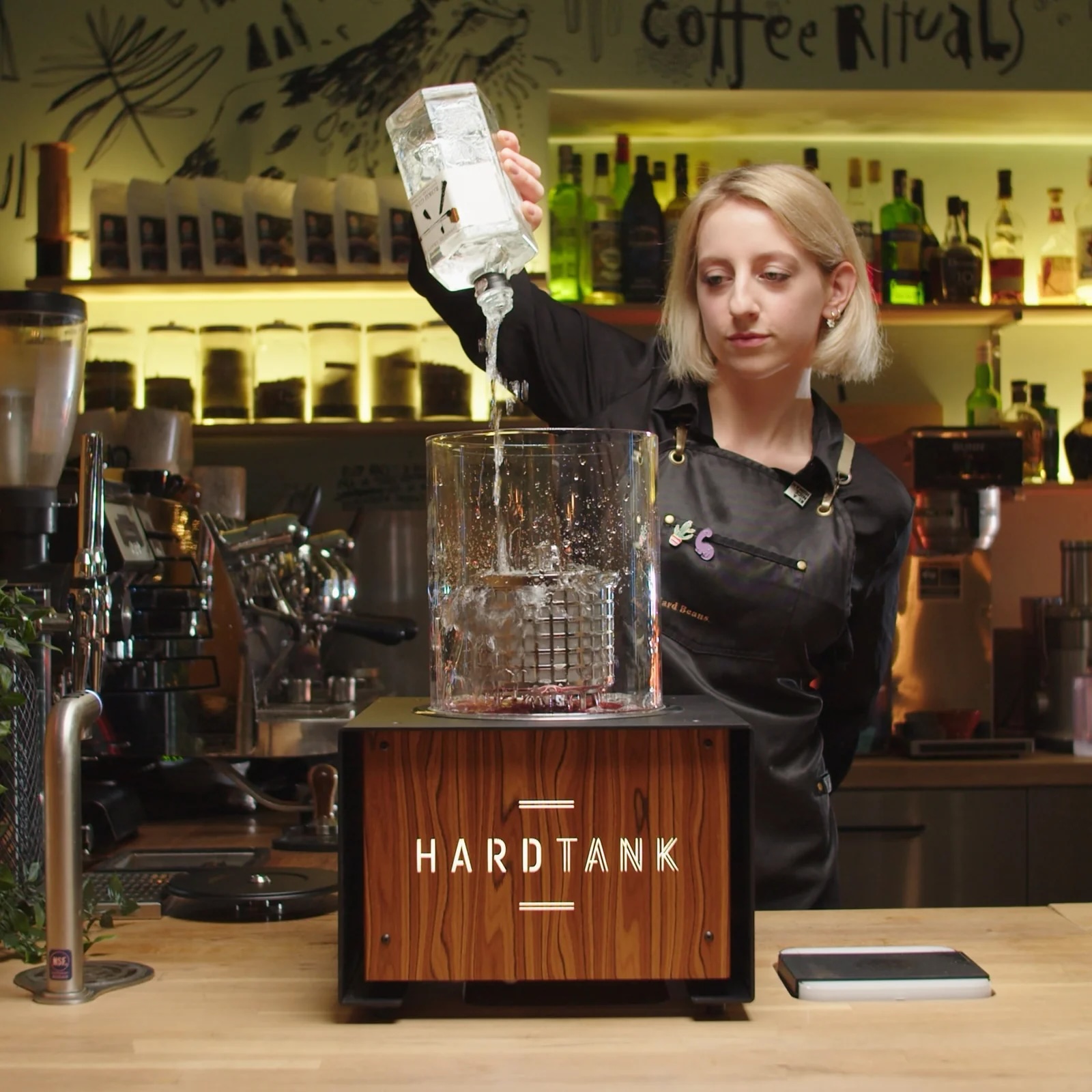 Bartender adding spirits to the Baby Hardtank