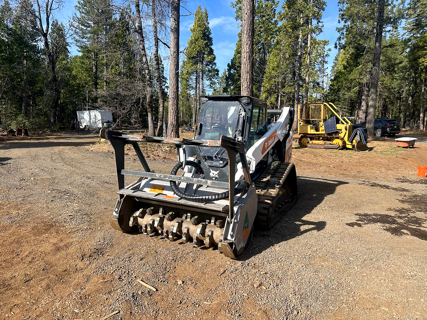 Crew performing brush clearing on a California hillside
