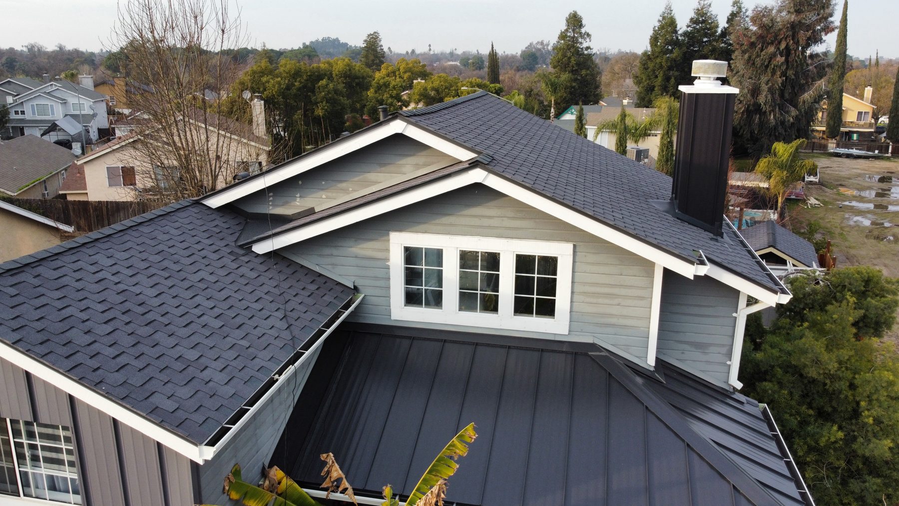 Finished shingle and standing seam roof