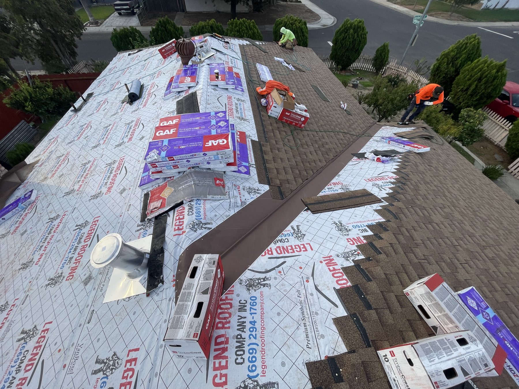 Crew installing GAF system over branded underlayment
