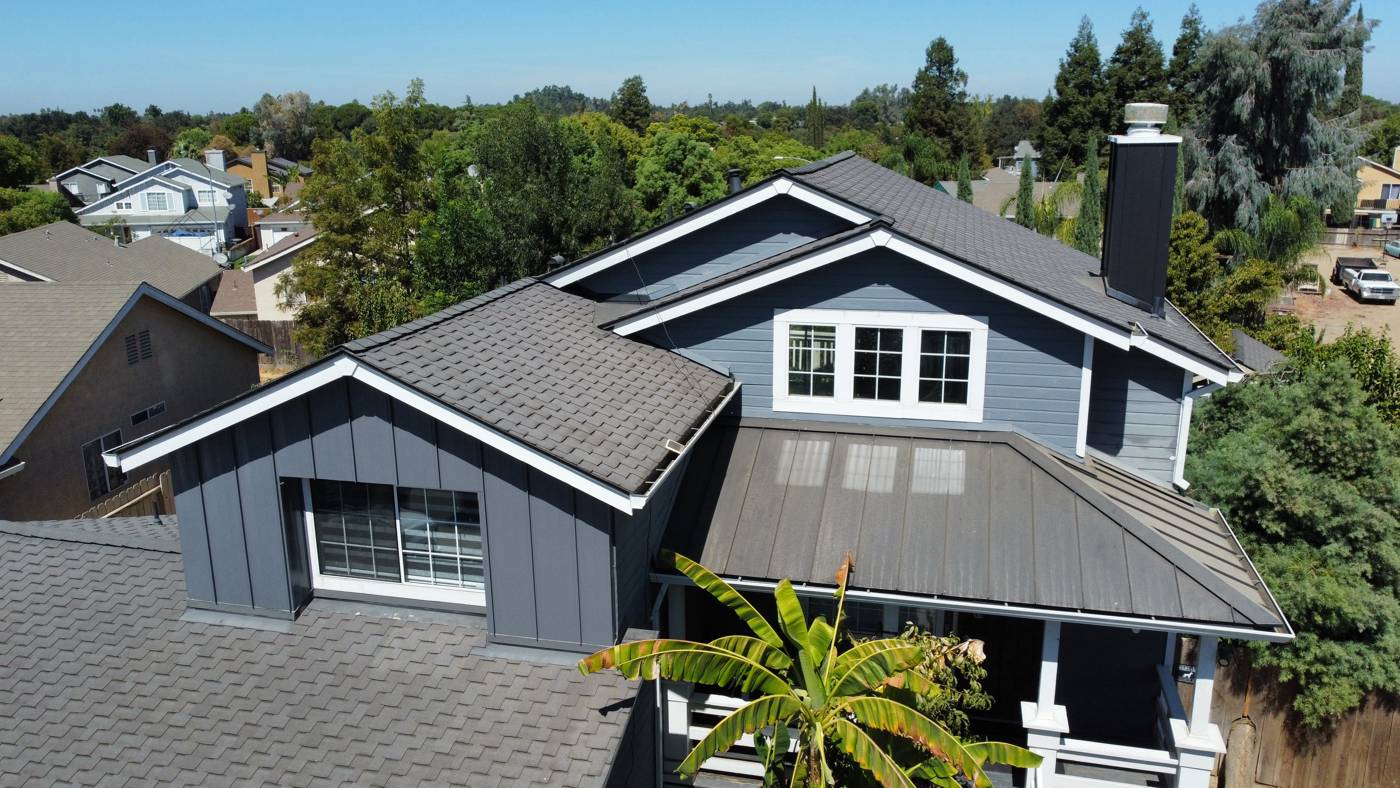 Finished charcoal shingles with metal porch