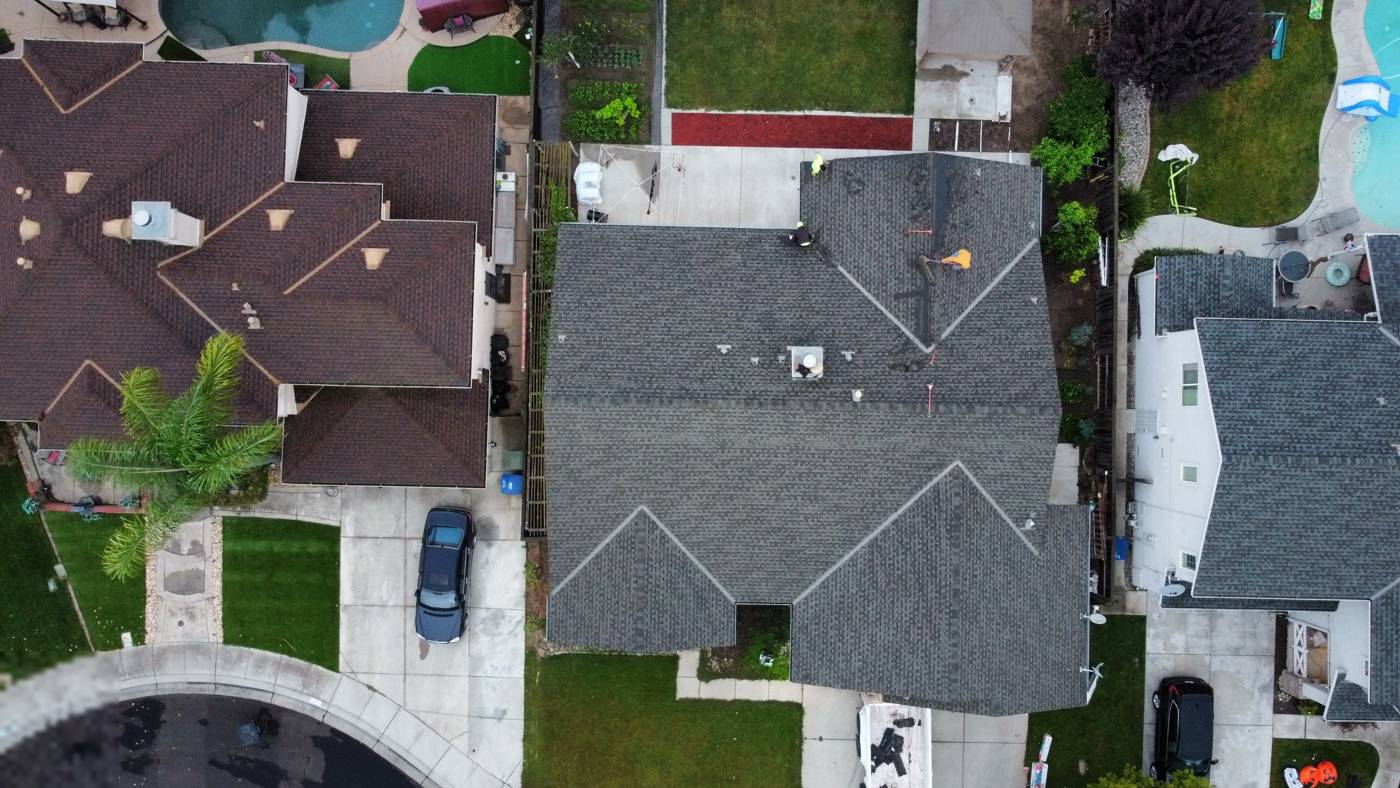 Crew installing shingles
