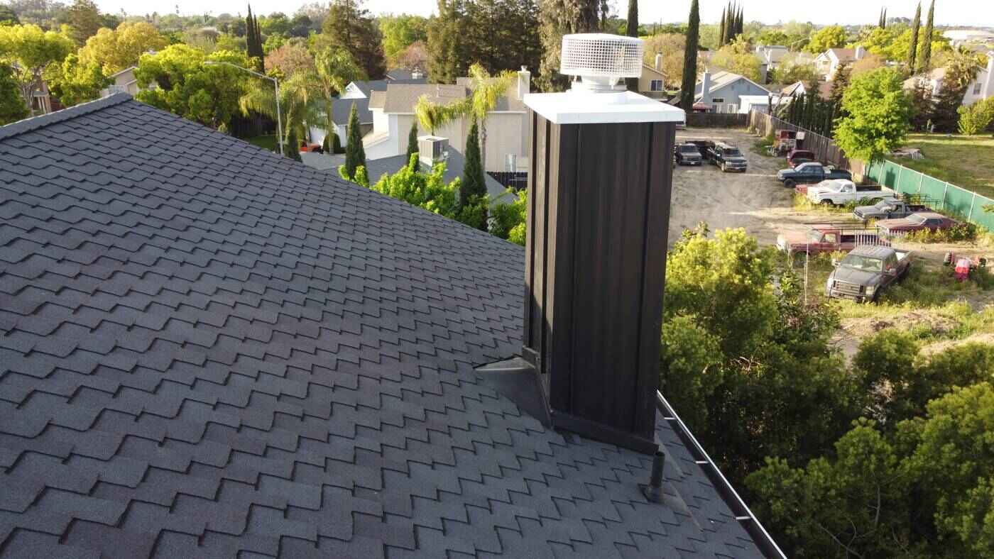Finished charcoal shingles and chimney detail