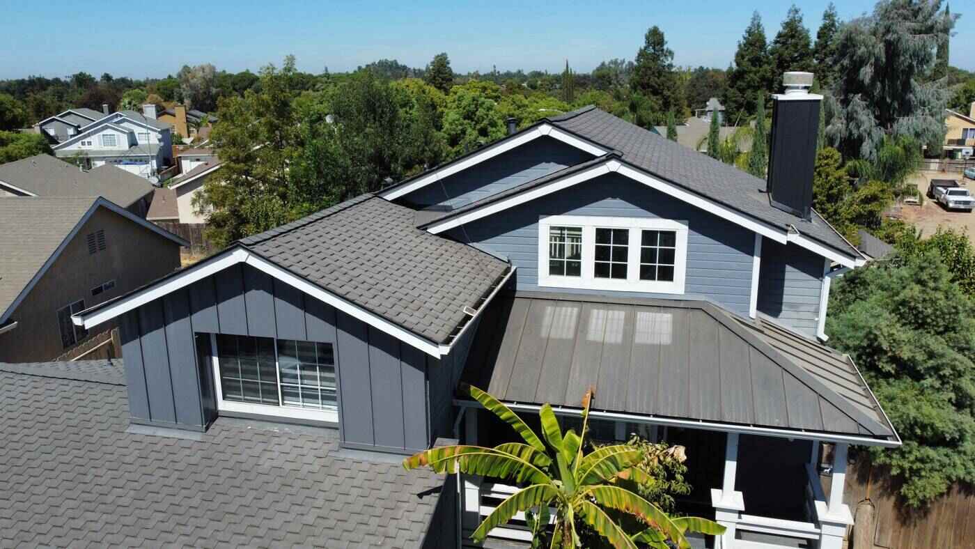Finished charcoal shingles with metal porch