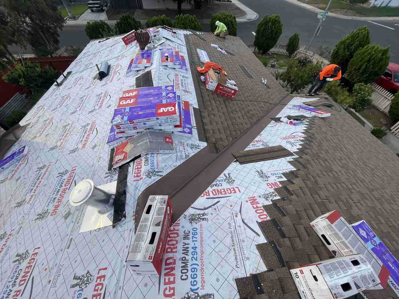 Crew installing GAF system over branded underlayment