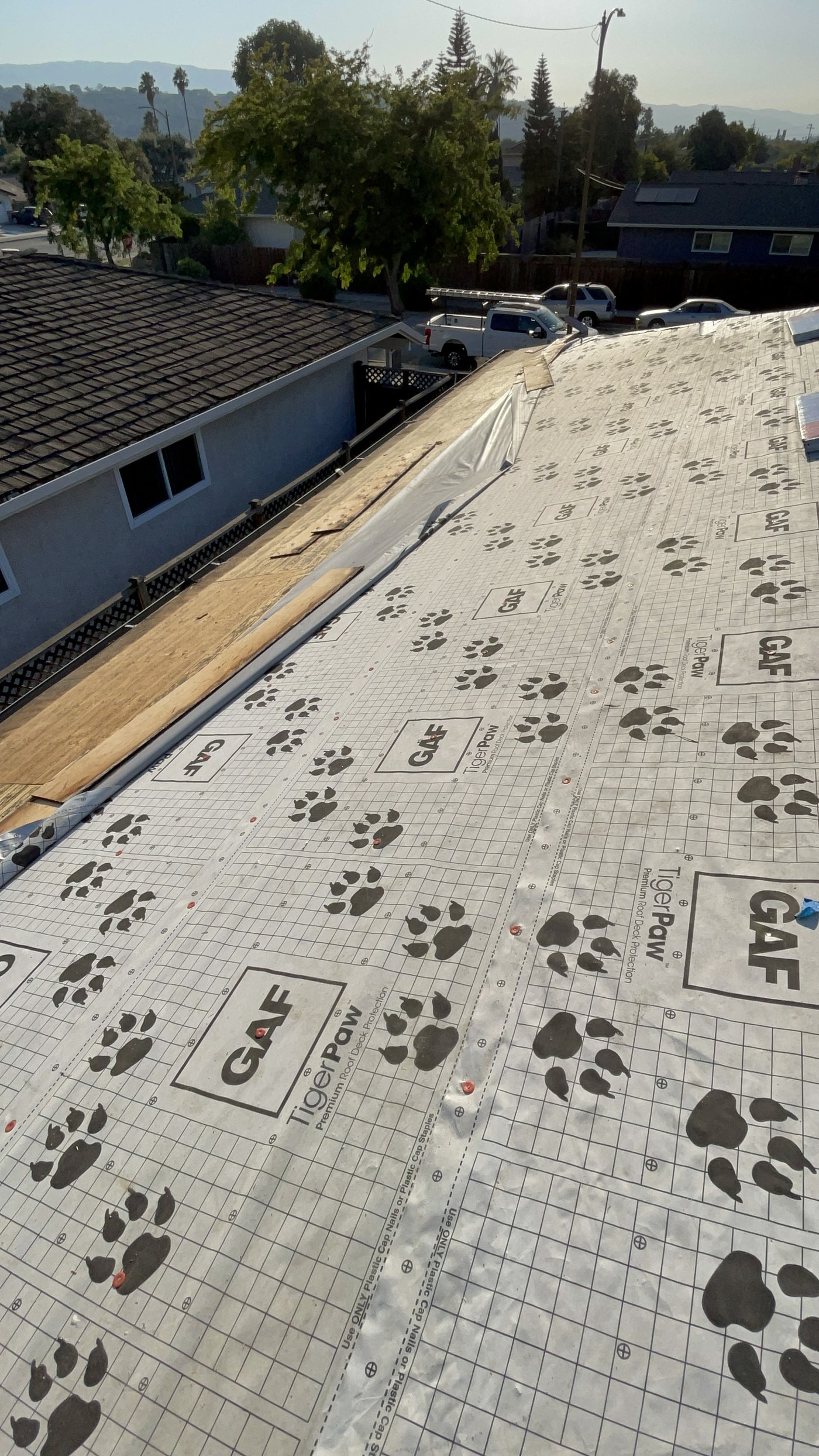 Close view of GAF TigerPaw synthetic underlayment covering a roof deck before shingles