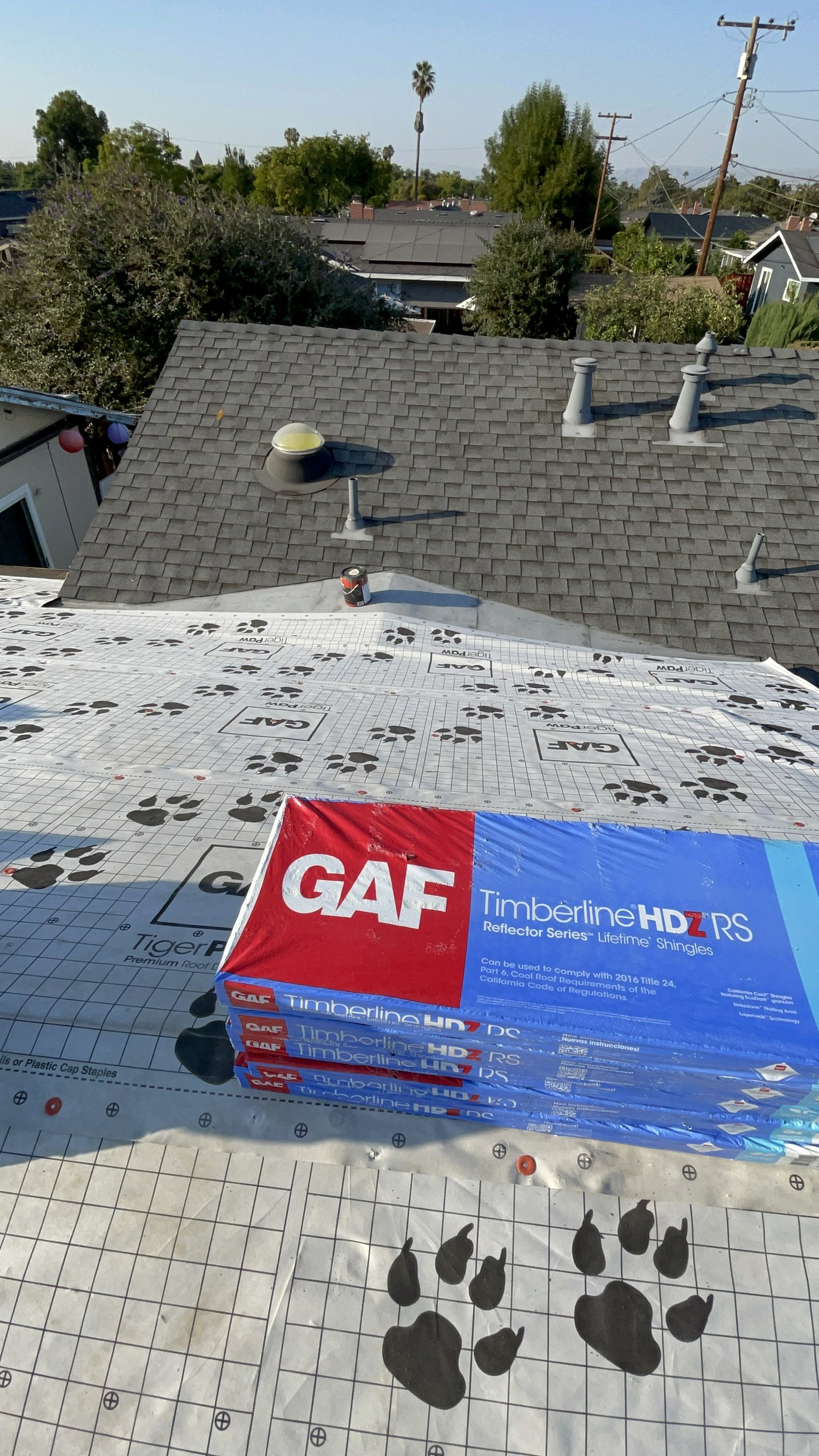 GAF TigerPaw underlayment and Timberline HDZ shingle bundles on a Modesto-area roof during replacement