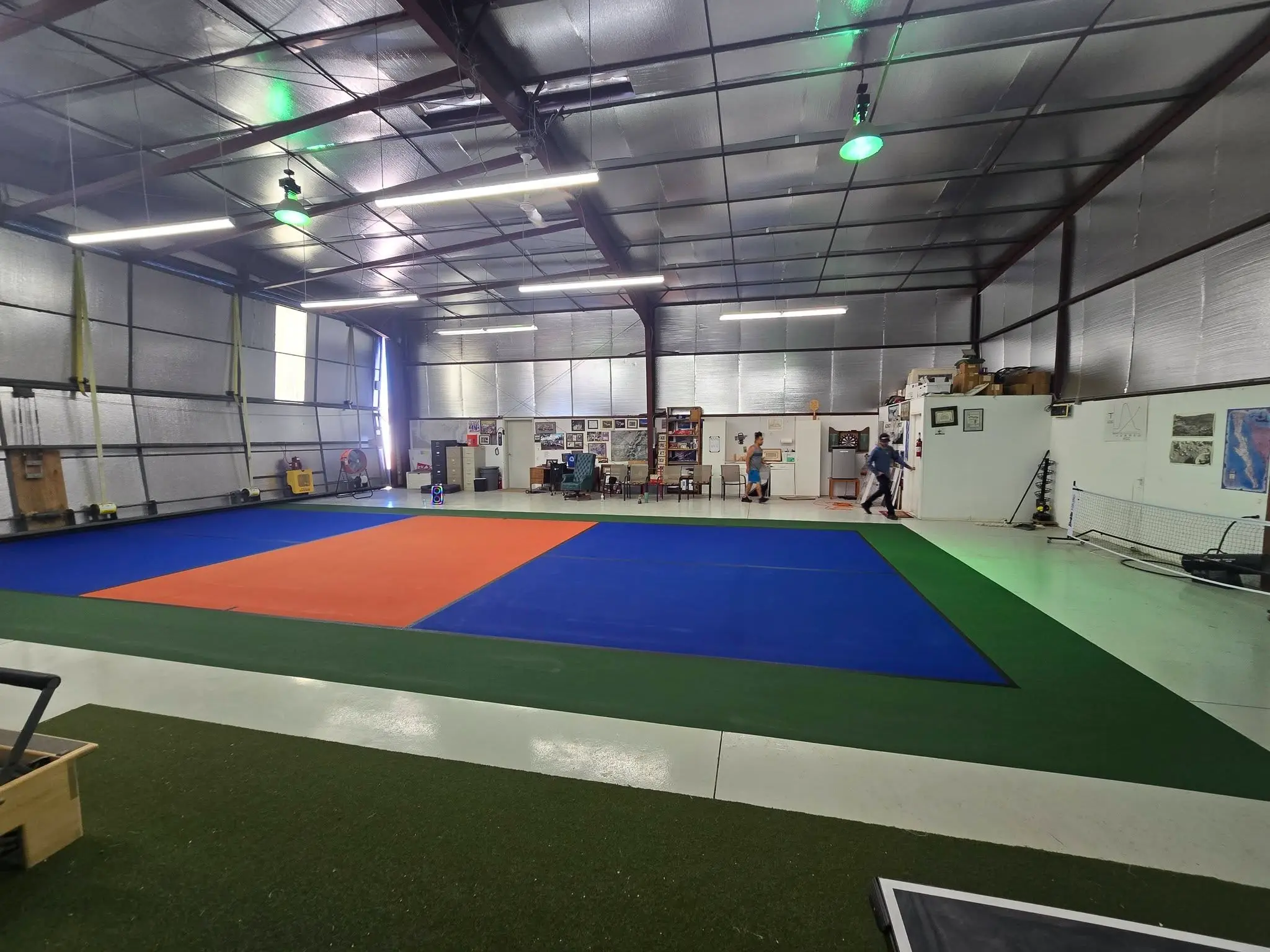 after image of from slick epoxy to Acrytech coating in a airplane hanger 