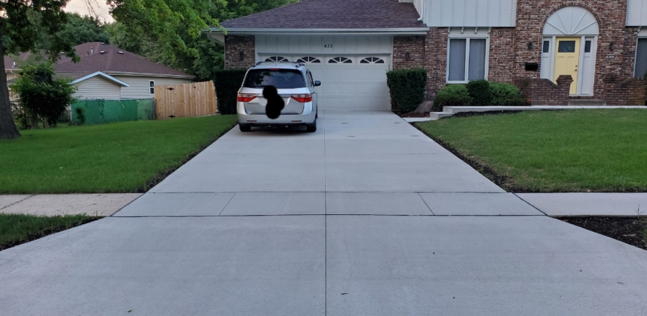 New clean concrete driveway after replacement