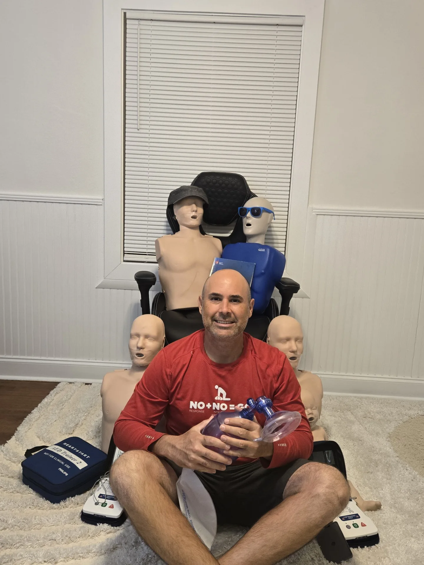 Alex, CPR Nurse Alex CPR instructor, with CPR mannequins and emergency training equipment