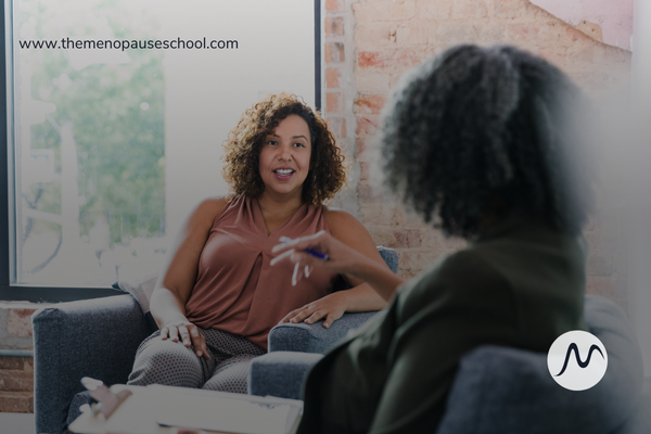 a menopause doula speaking with a client