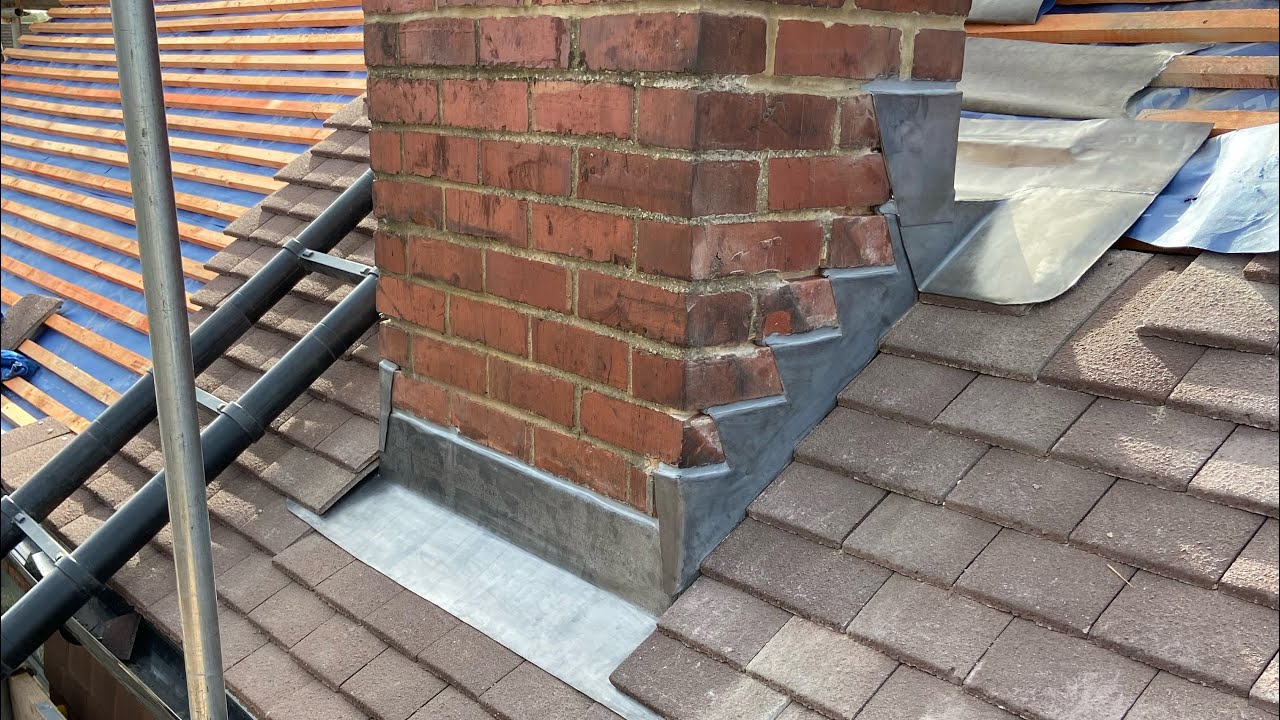 Roof flashing inspection around chimney to prevent storm leaks in Maryland
