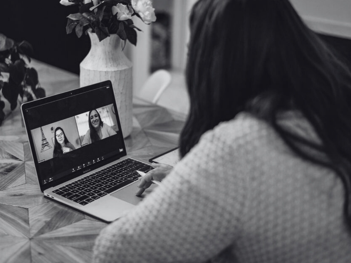 Podcast strategy planning session with notes and laptop