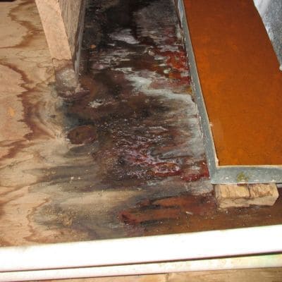 Water leak damage on wooden floor