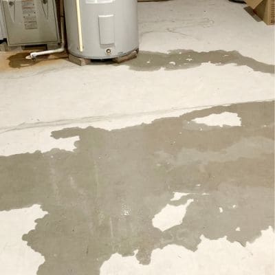 Water heater leak spreading on concrete floor