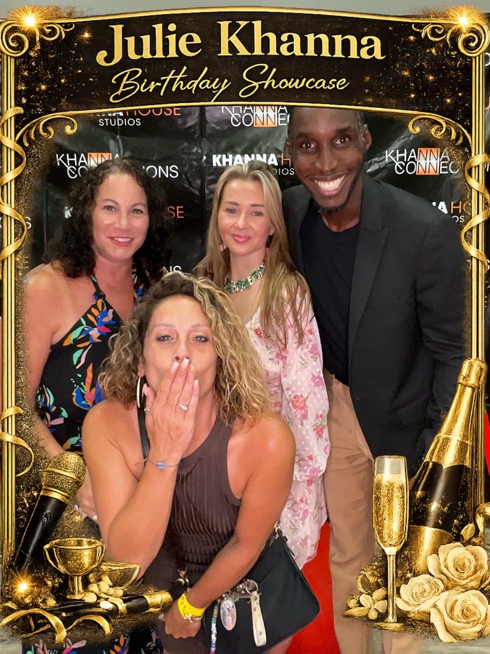 Guests celebrating at the Julie Khanna birthday showcase photo booth