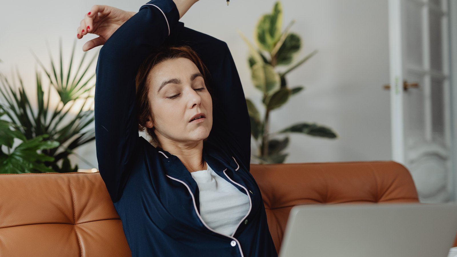Woman stretching on the couch