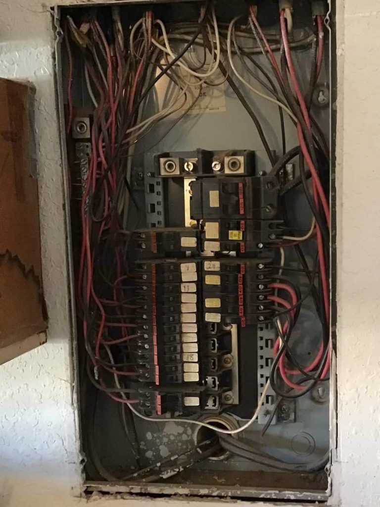 Older breaker panel being replaced.