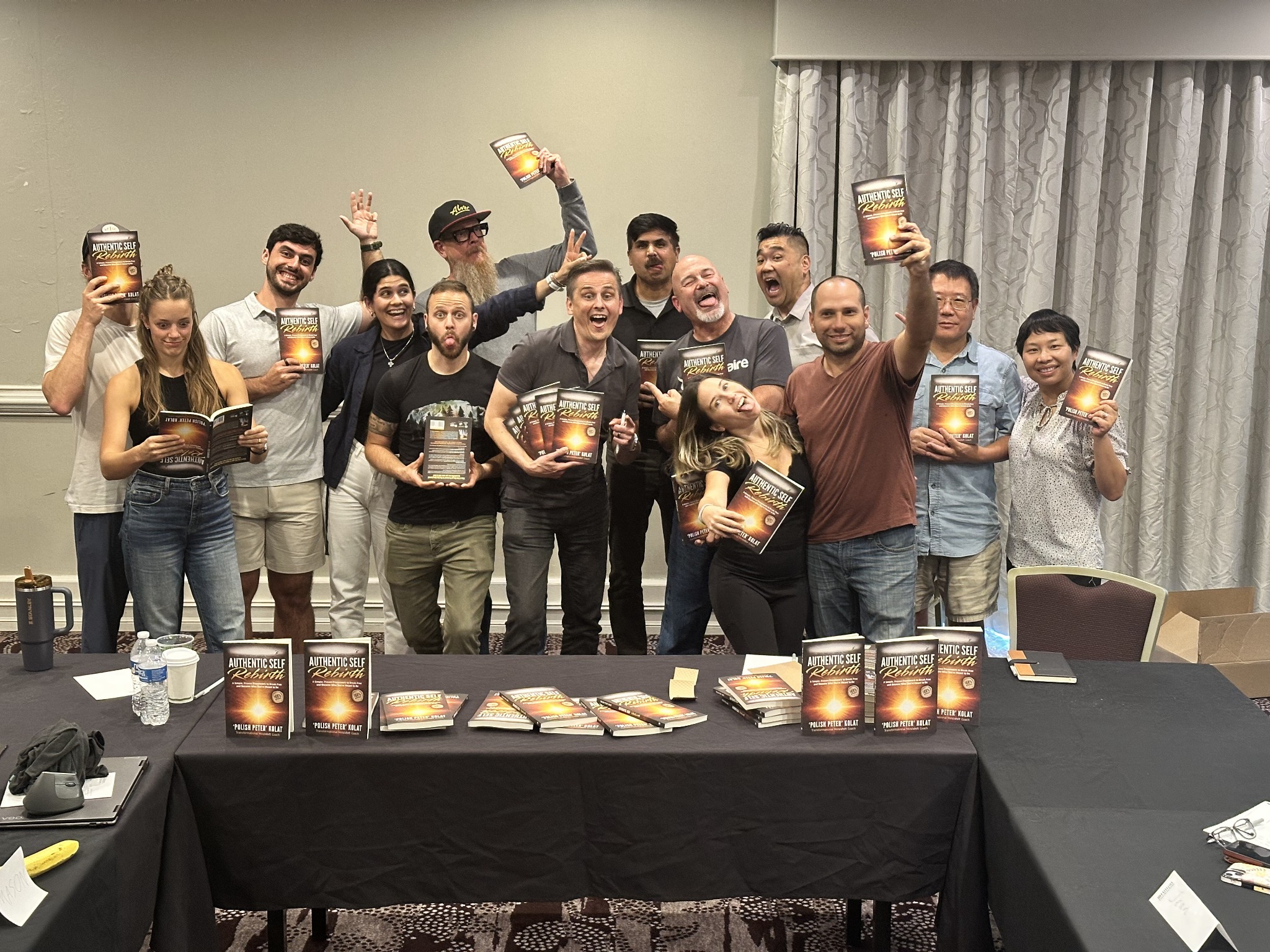 A group of readers each holding Authentic Self Rebirth