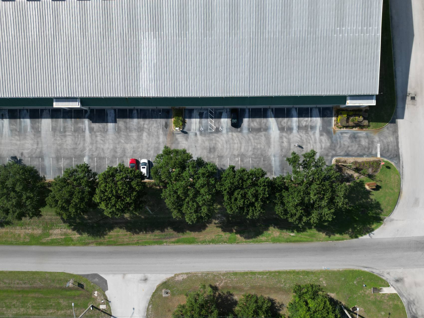 Faded, worn parking lot before restriping