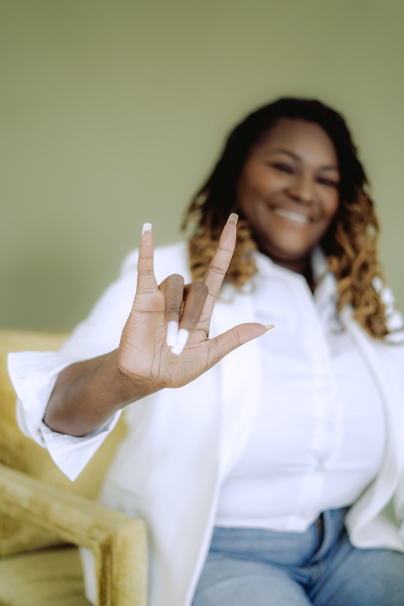 Starr Clinton signing I love you in ASL