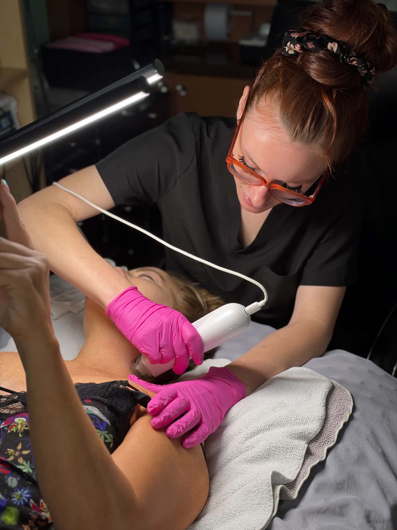 Rachel performing an Ultra Cold T33 treatment