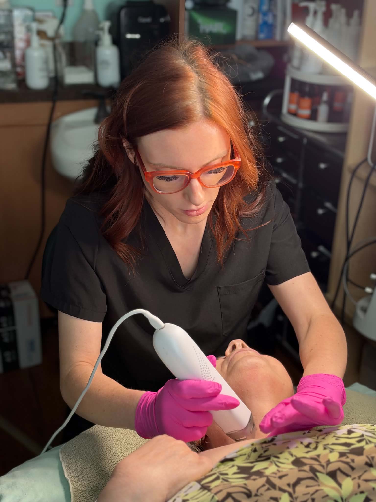 Rachel performing an Ultra Cold T33 scalp treatment at Anoint Head Spa and Wellness