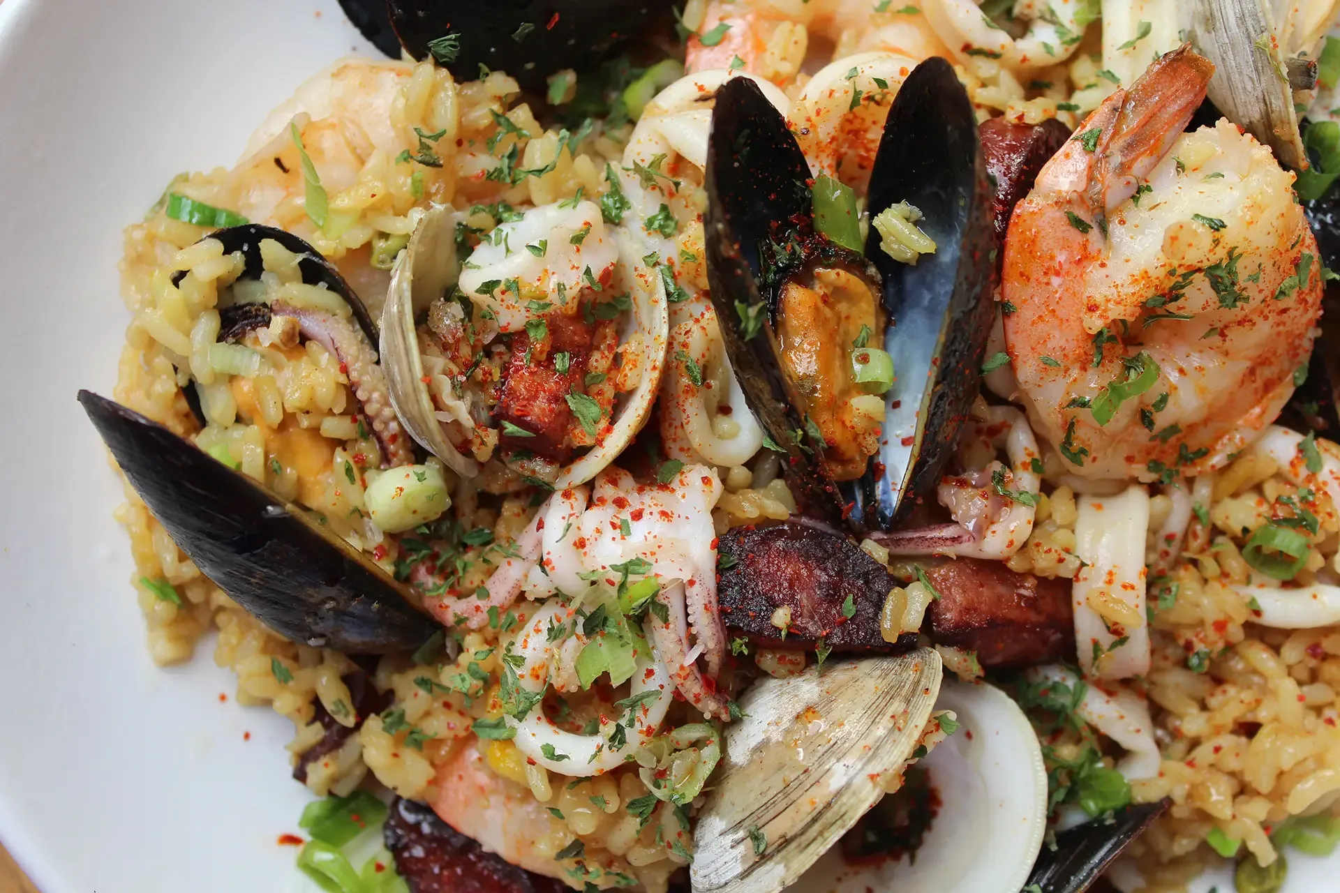 Platter of the Best Seafood in French Quarter Charleston with mussels, shrimp, and sausage at Oyster House.