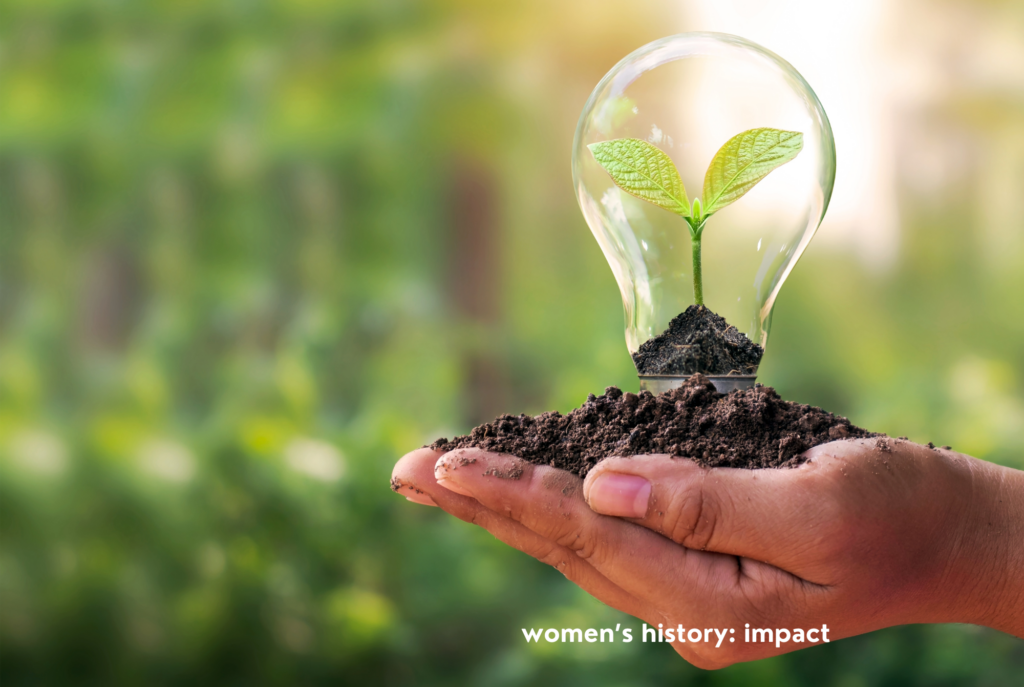 A woman's hand holds a scoop of dirt with a lightbulb planted in it, and a sprout forming inside the bulb.