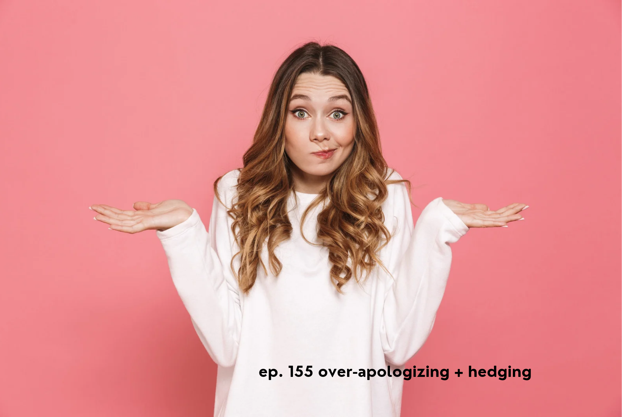 A tween or teen girl holds her hands up as if to apologize