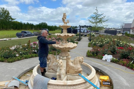 Custom masonry fountain sculpture installed by Hamilton bricklayers for elegant outdoor landscaping