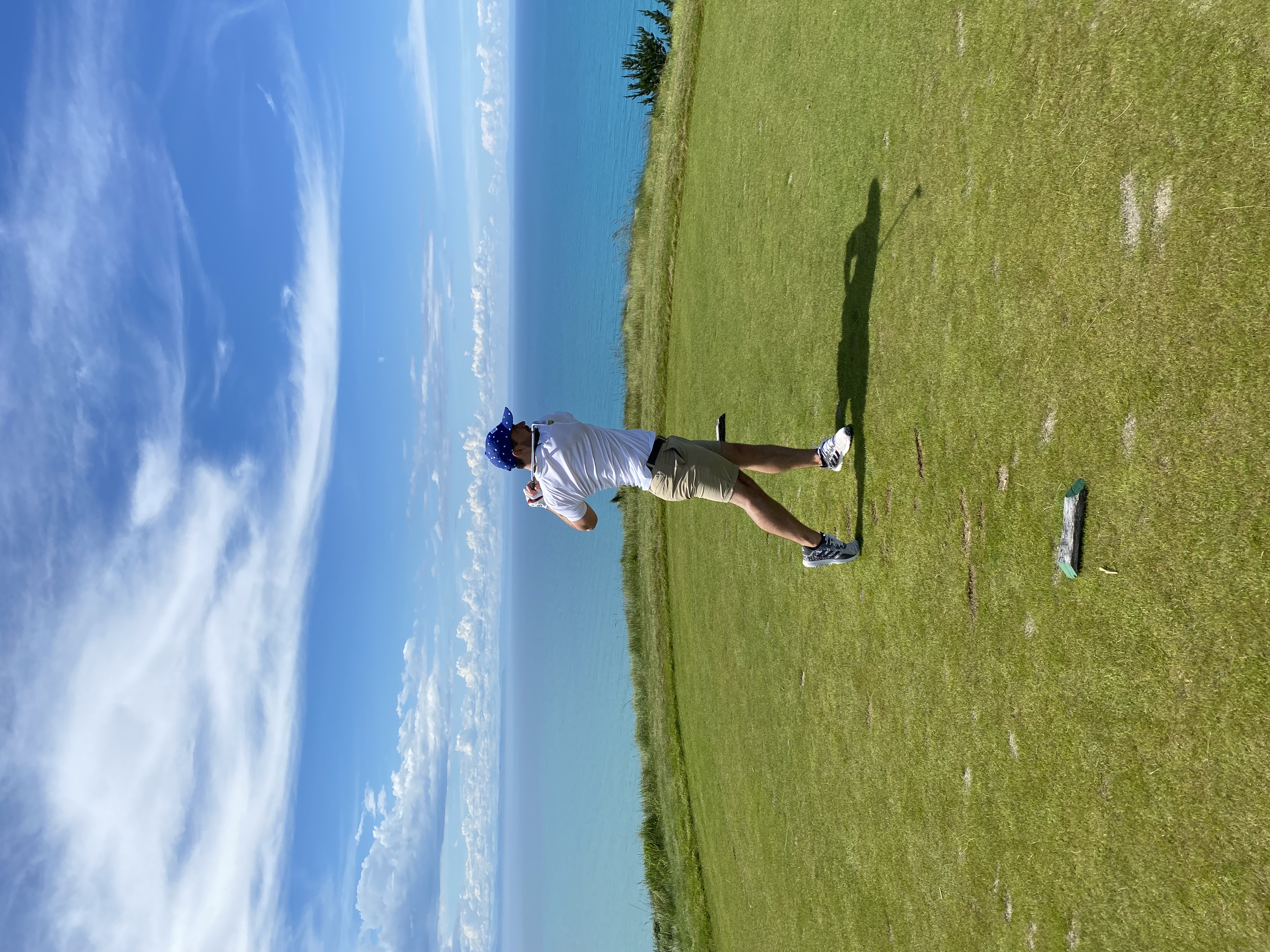 Golfer driving down the fairway