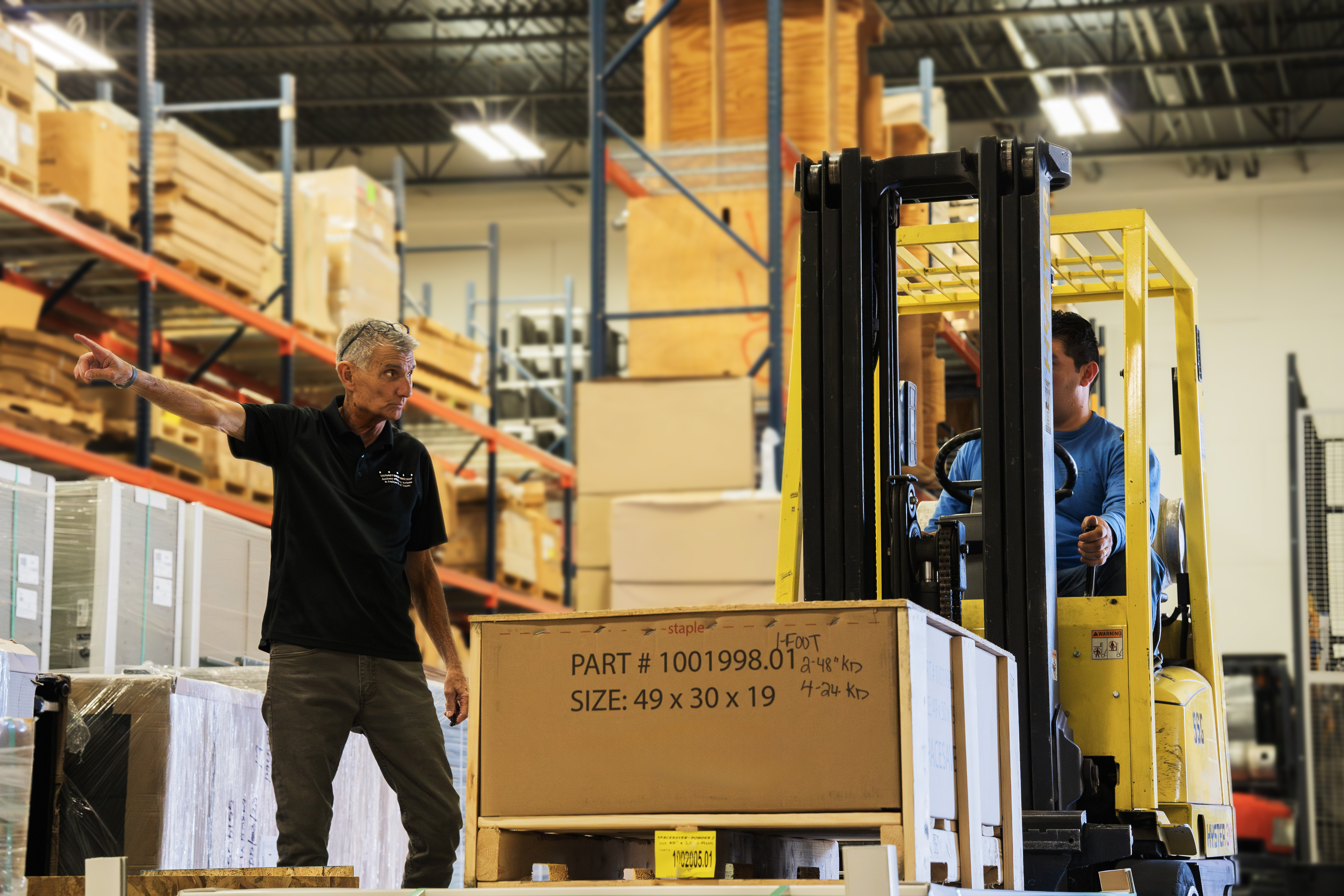 Warehouse worker with forklift