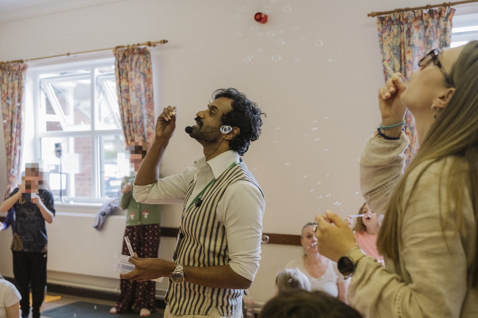 Neel leading a breathing game with bubbles