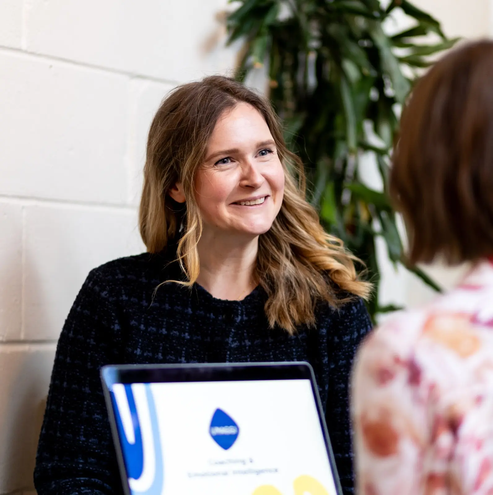 Unaggi Coaching client smiling during coaching session