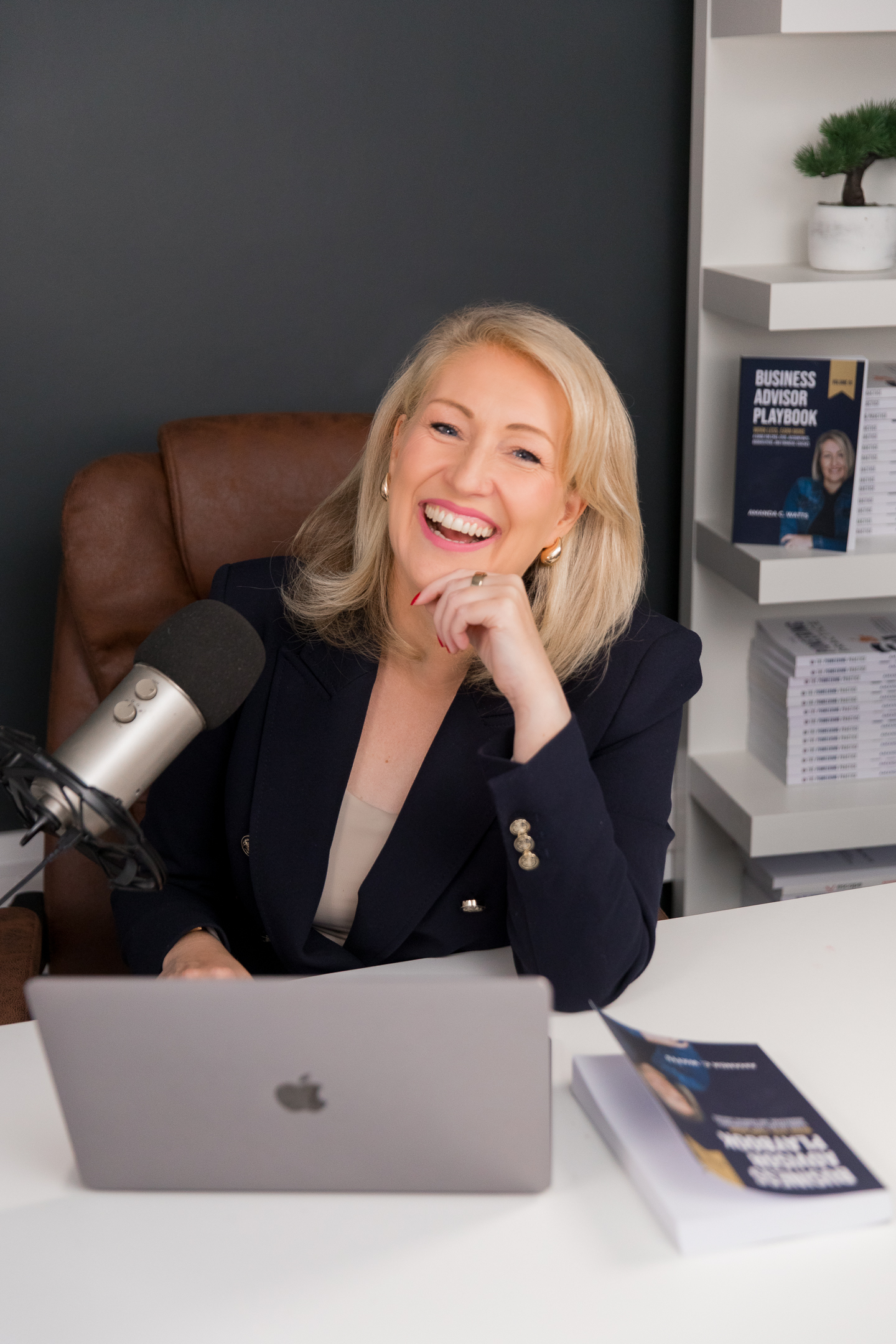 Amanda laughing at her desk