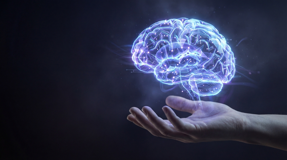 A glowing brain held in an open hand