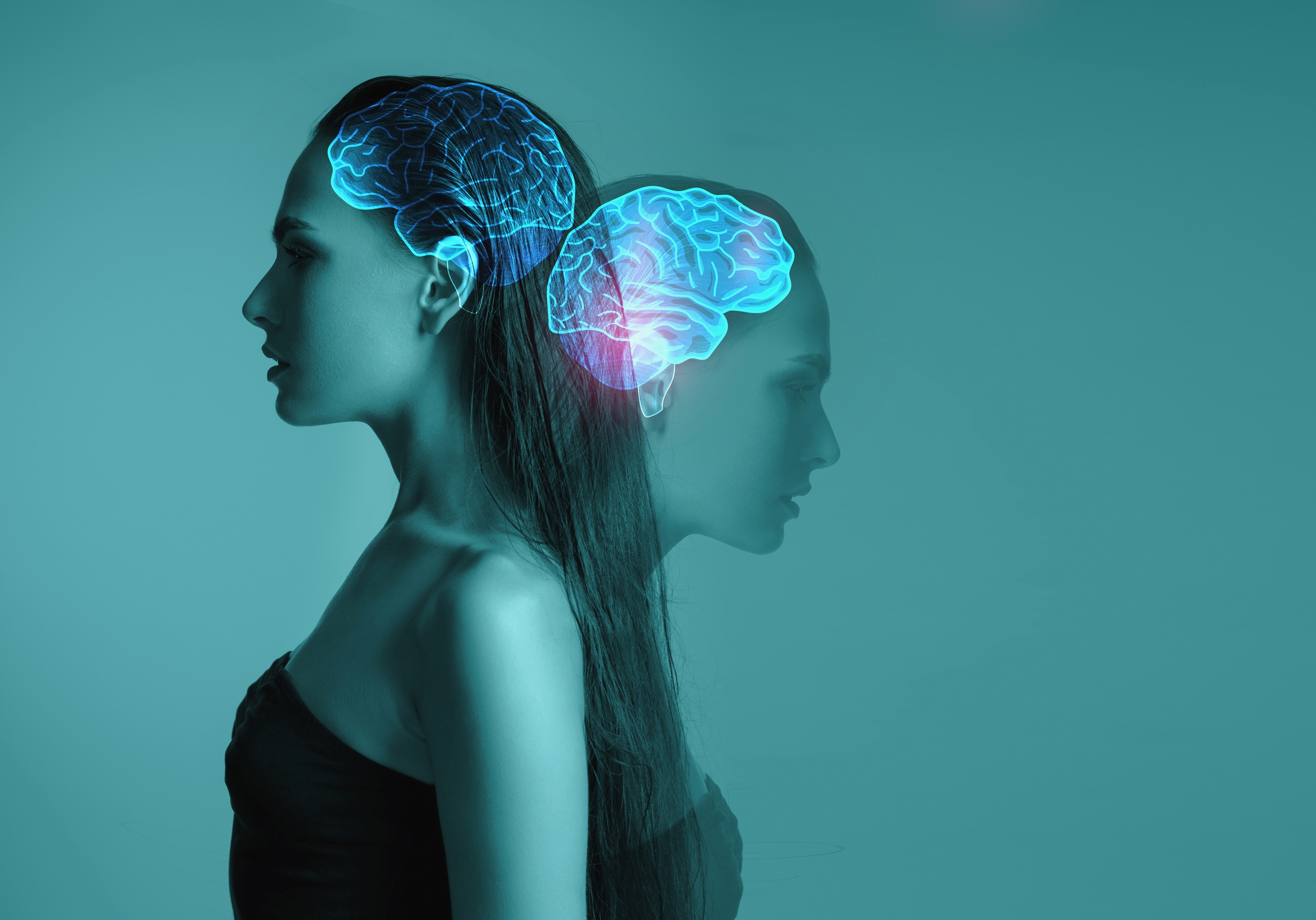 Two people with a glowing brain between them, representing shared insight and development