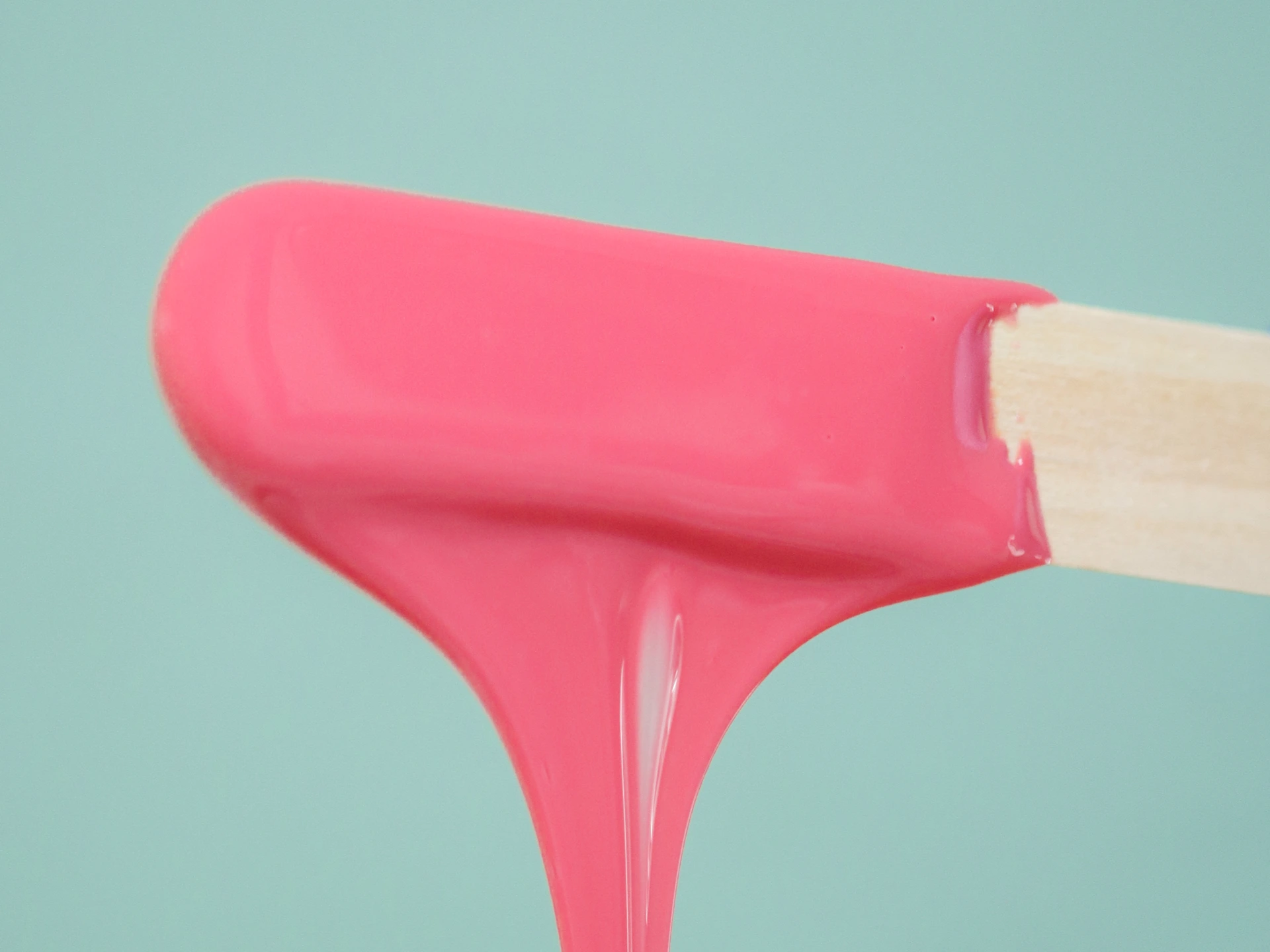 Waxing treatment, pink wax on applicator