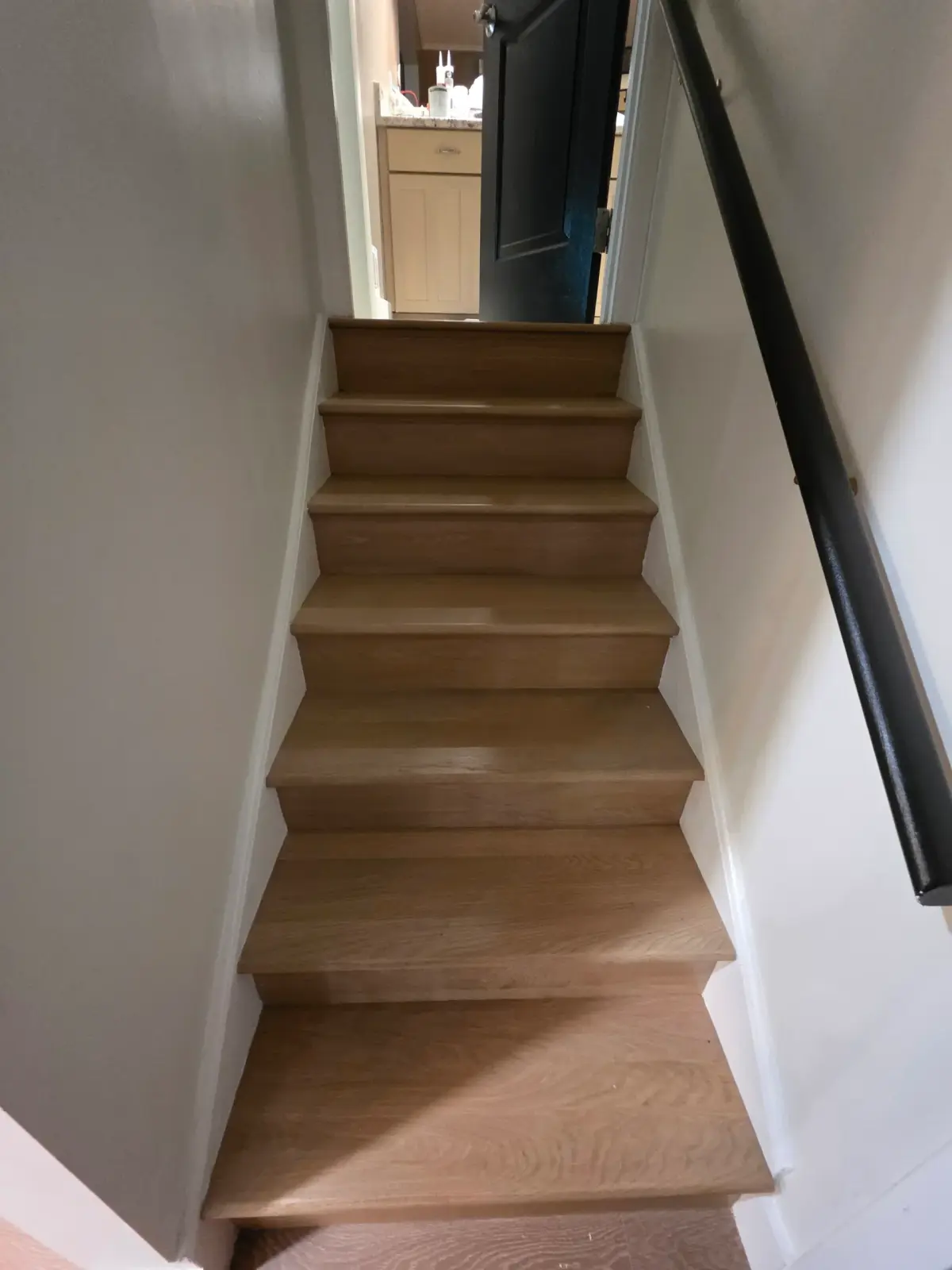 LVP stair nose installation in Centreville VA showcases seamless integration with luxury vinyl plank flooring.