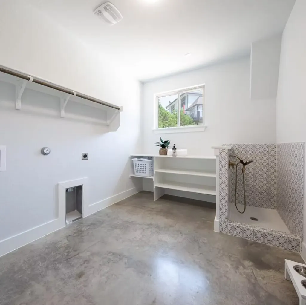 Beautiful modern Austin Texas custom home with lush landscaped yard large windows driveway and stylish outdoor decor