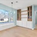 Home remodeling in Brentwood TX features a stylish living room with modern furnishings, wooden floors, and natural light.