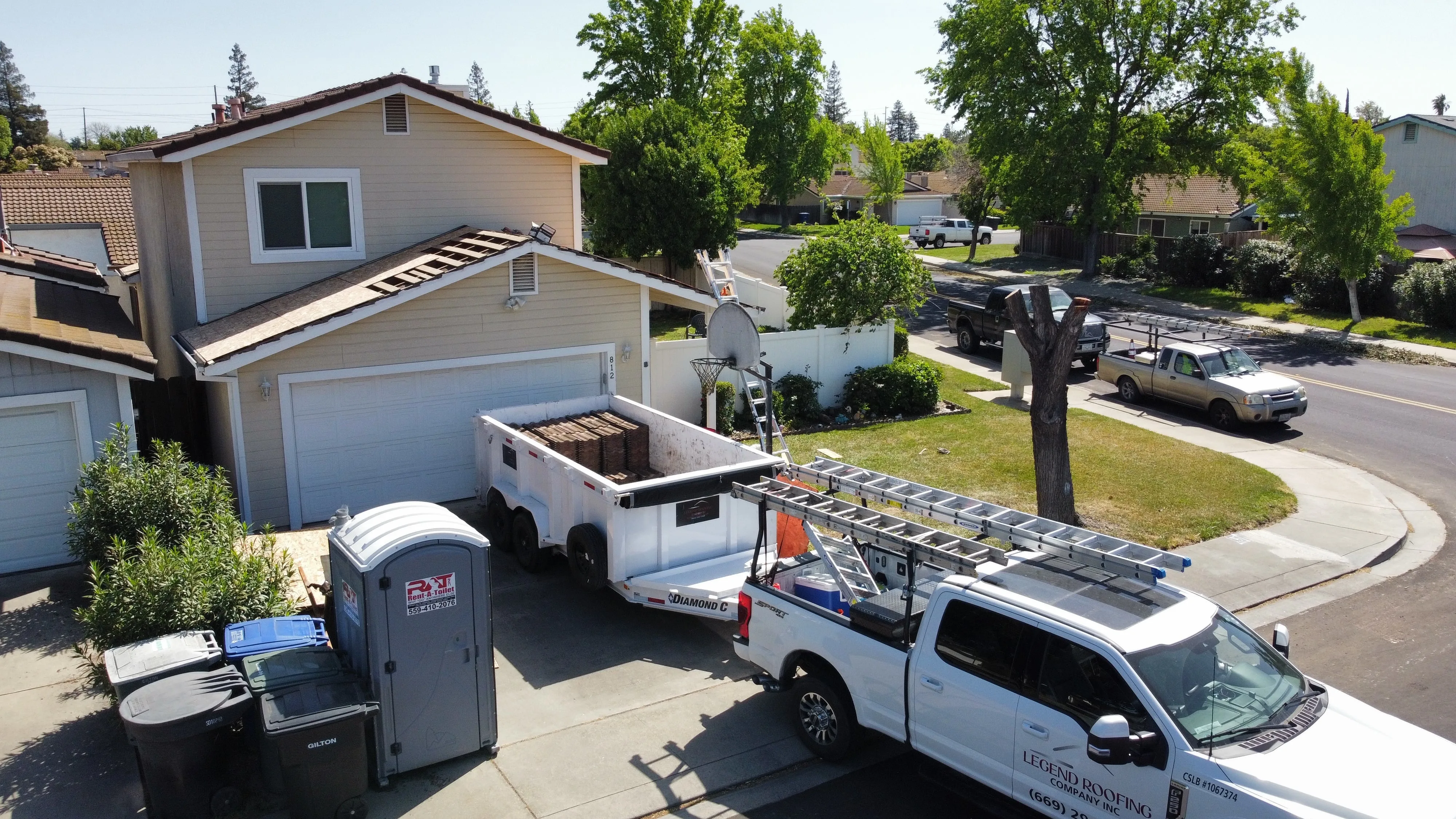 Freshly completed roof replacement on a modern home in Modesto CA showcasing quality craftsmanship and a well-maintained yard.